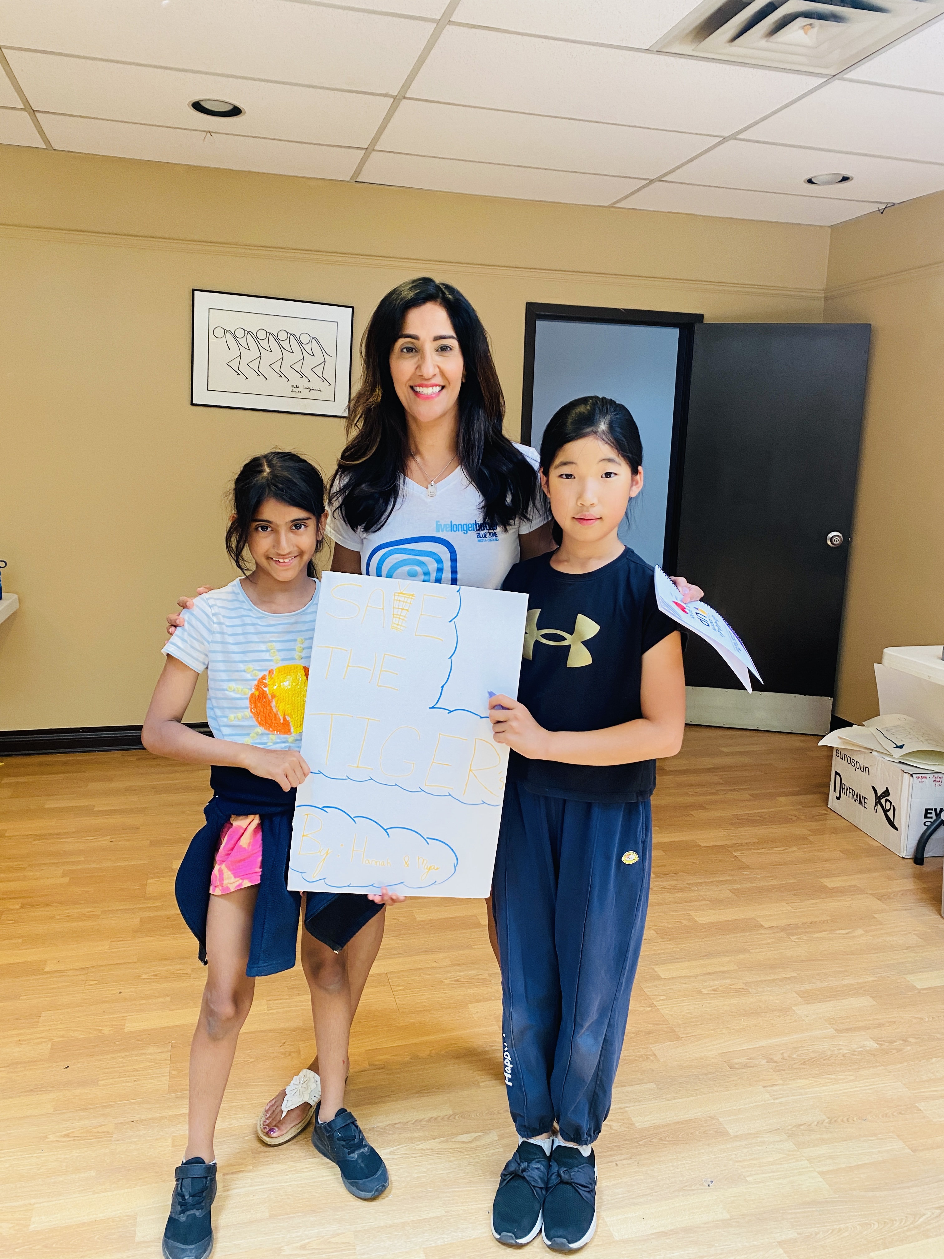 Dr. Shimi Kang with two students